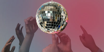 Image of a disco ball with photos of hands on the bottom. There are pink and blue hues in the background
