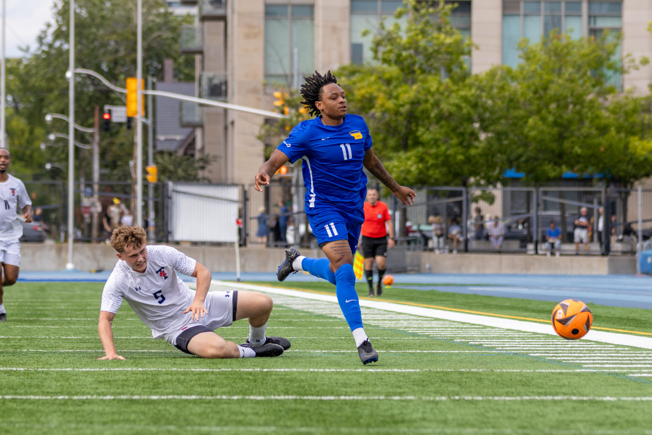 Bold player wins a ground duel, leaving opposing player trailing.