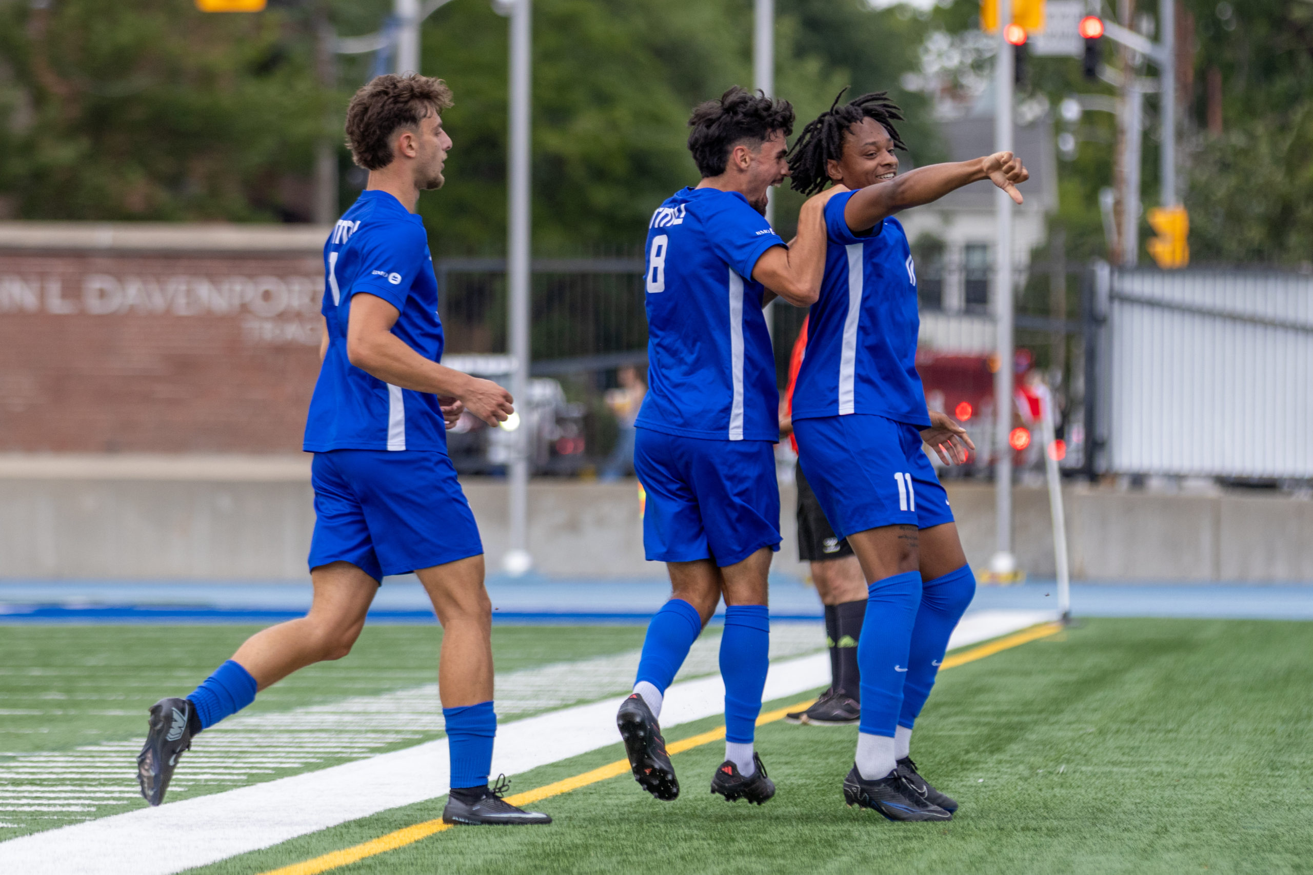 Bold players celebrate on the pitch.