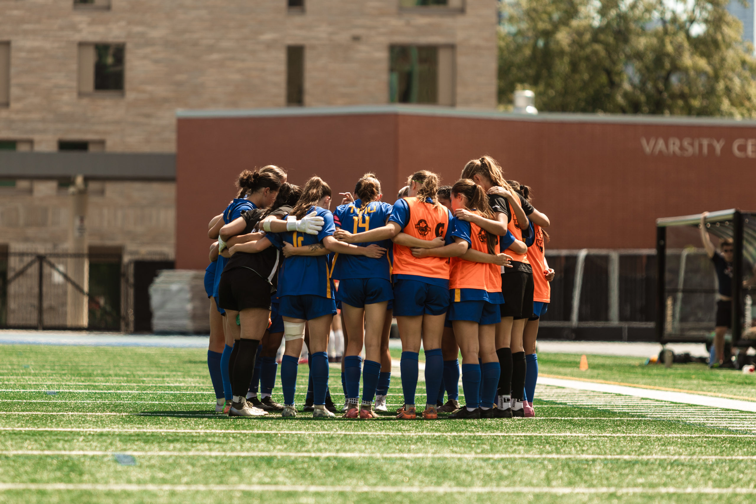 Bold huddle together on the pitch.