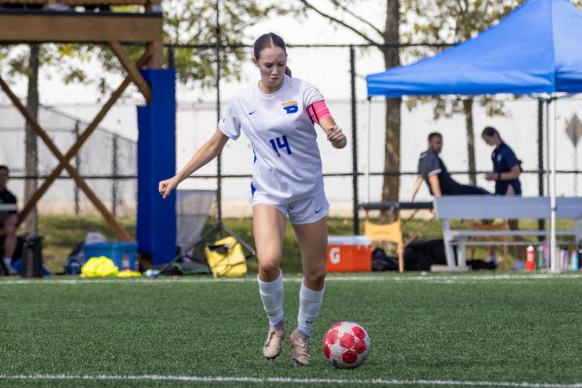 Bold midfielder, Natalie Moynihan prepares to strike the ball.