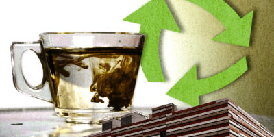 A collage about data centres and water consumption. A glass of water with brown colour mixing into it, as well as a data centre are spliced in front of a recycling logo.