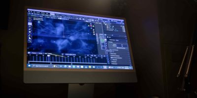 Picture of a monitor with a screen showing a VFX software interface.