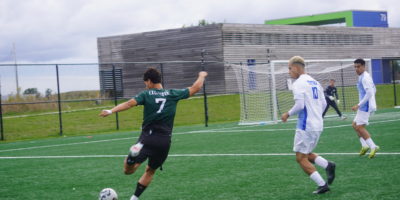 Trent soccer player strikes the ball
