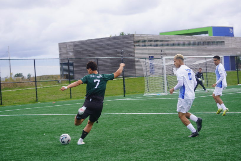 Trent soccer player strikes the ball