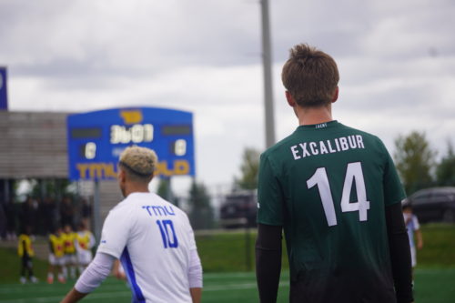 An Excalibur and Bold player look out across the pitch