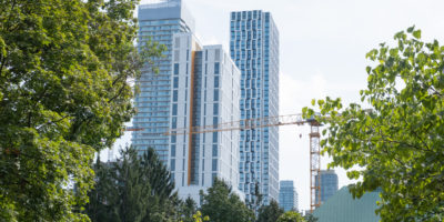 A photo of the Daphne Cockwell Complex in Toronto's skyline.