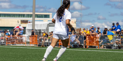 TMU women's soccer player faces away from the camera