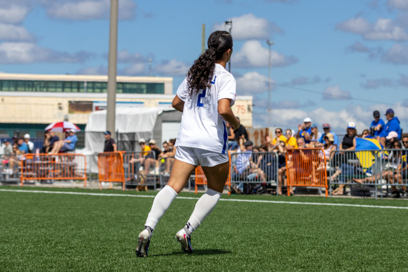 TMU women's soccer player faces away from the camera