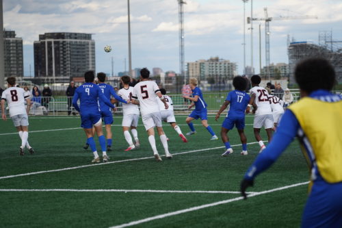 TMU and Carleton lineups pursue an aerial ball