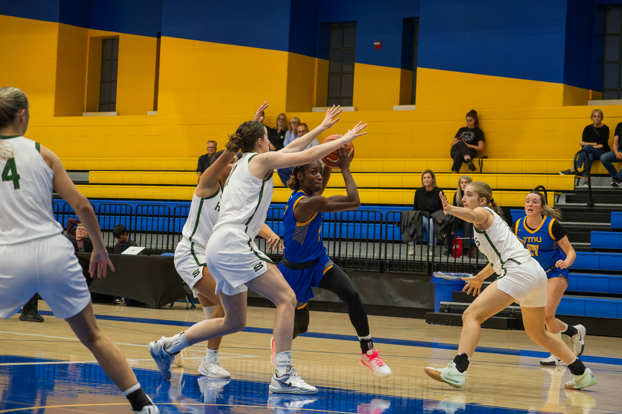 Saskatchewan players mark a lone TMU player